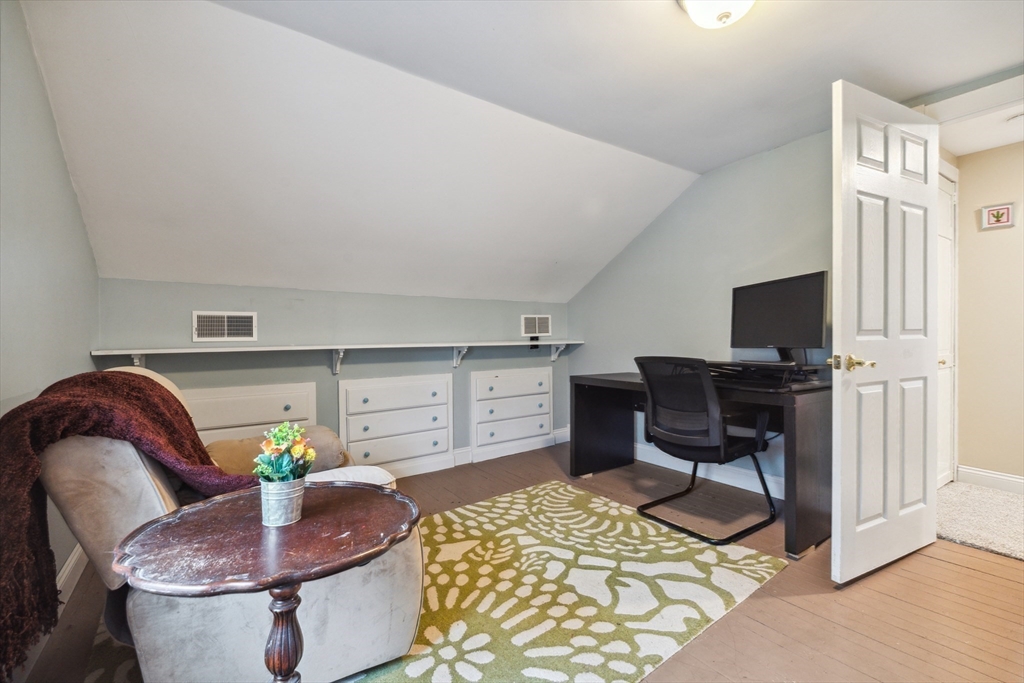 162 Proctor Road Chelmsford, MA 01824 - Photo 26 of 35 a living room with furniture and a flat screen tv