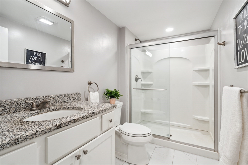 162 Proctor Road Chelmsford, MA 01824 - Photo 28 of 35 a bathroom with a granite countertop sink toilet and shower