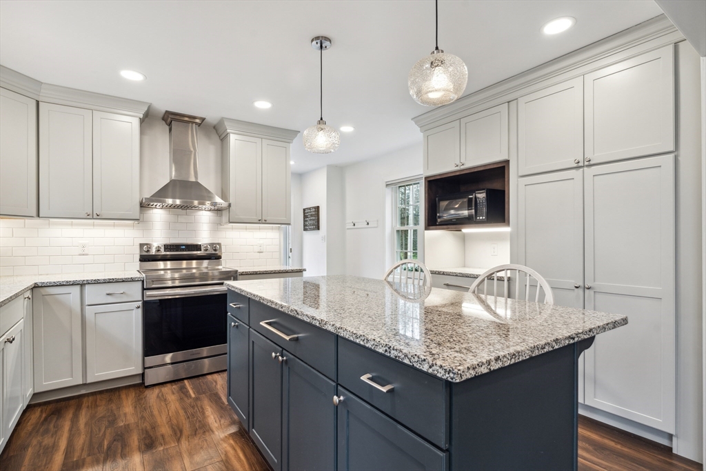 162 Proctor Road Chelmsford, MA 01824 - Photo 3 of 35 a kitchen with stainless steel appliances granite countertop a sink stove and refrigerator