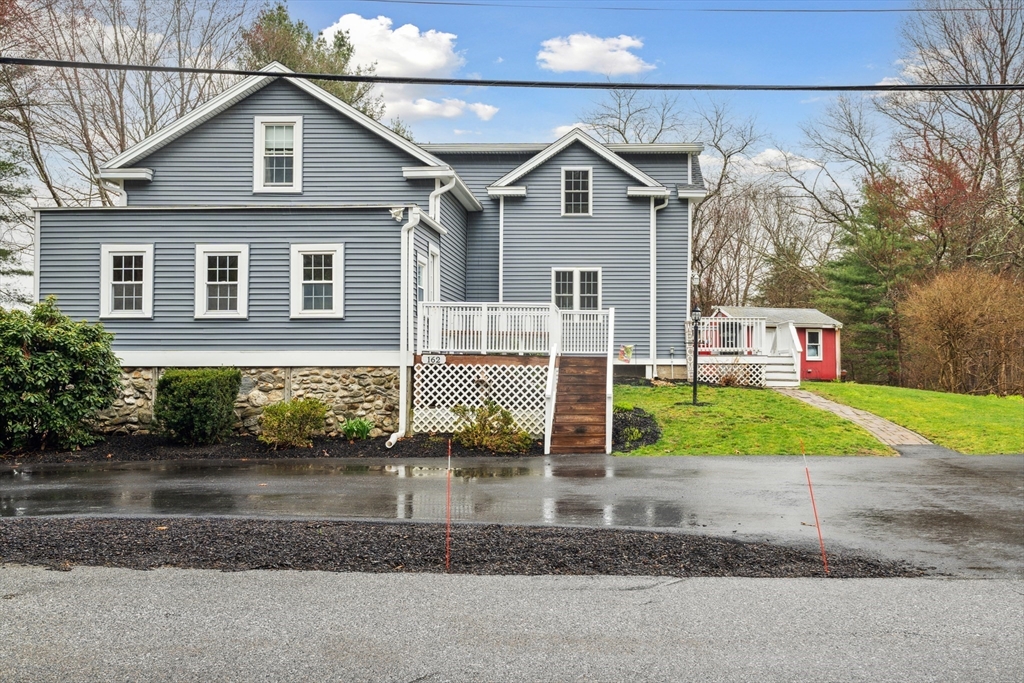 162 Proctor Road Chelmsford, MA 01824 - Photo 33 of 35 a front view of a house with garden