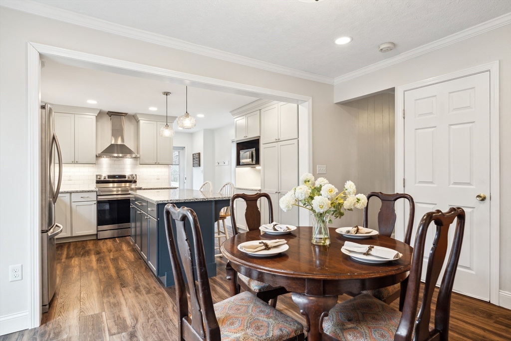 162 Proctor Road Chelmsford, MA 01824 - Photo 7 of 35 a view of a dining room with furniture and wooden floor