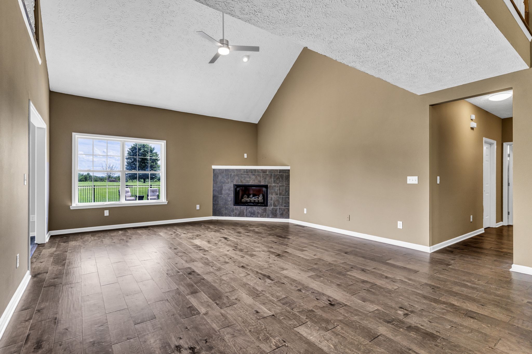 6689 East Benton Road Springfield, TN 37172 - Photo 16 of 44 a view of an empty room with wooden floor and a window
