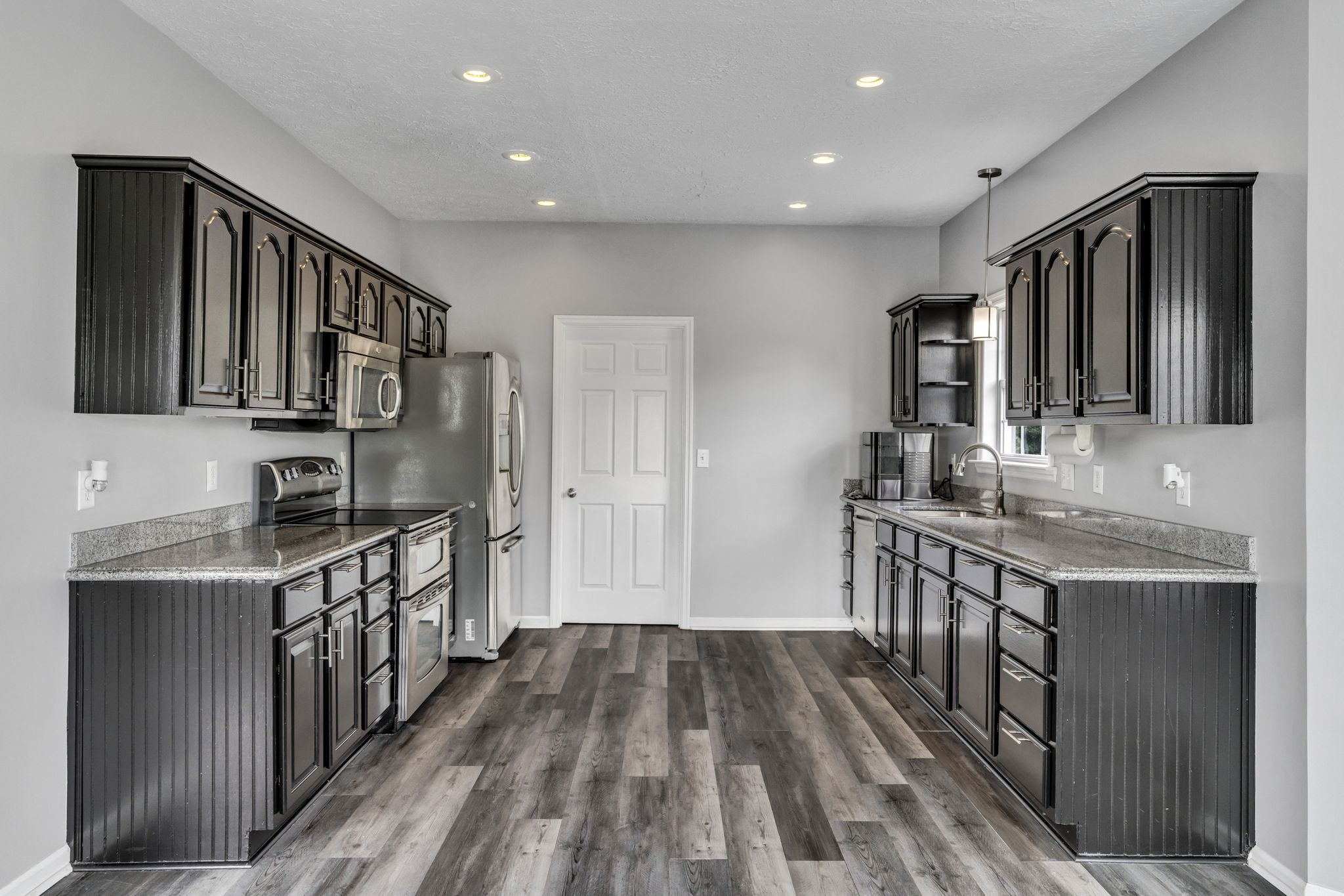 6689 East Benton Road Springfield, TN 37172 - Photo 19 of 44 a kitchen with stainless steel appliances granite countertop a stove and a sink