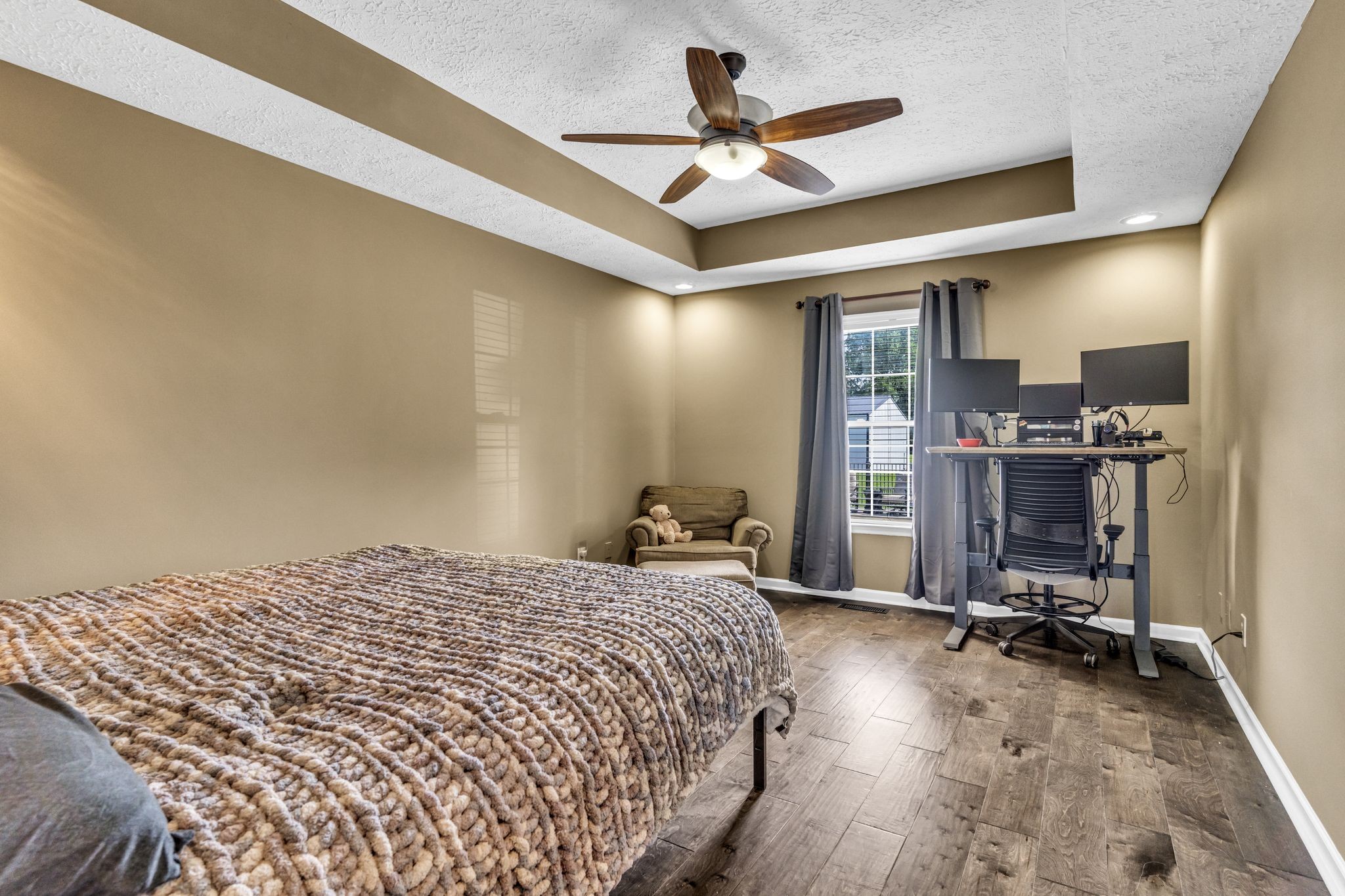 6689 East Benton Road Springfield, TN 37172 - Photo 28 of 44 a bedroom with a bed and a ceiling fan