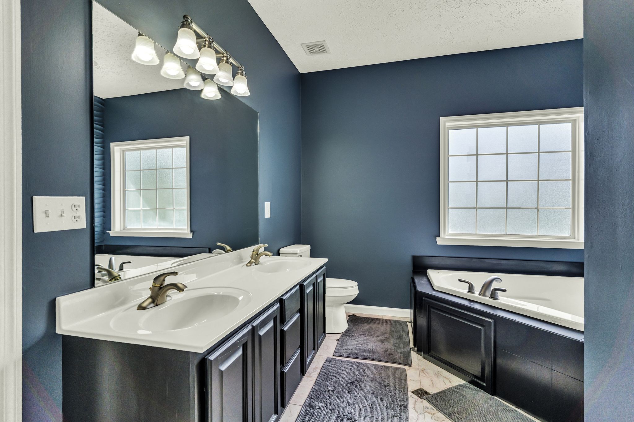 6689 East Benton Road Springfield, TN 37172 - Photo 29 of 44 a kitchen with a stove a sink and a window