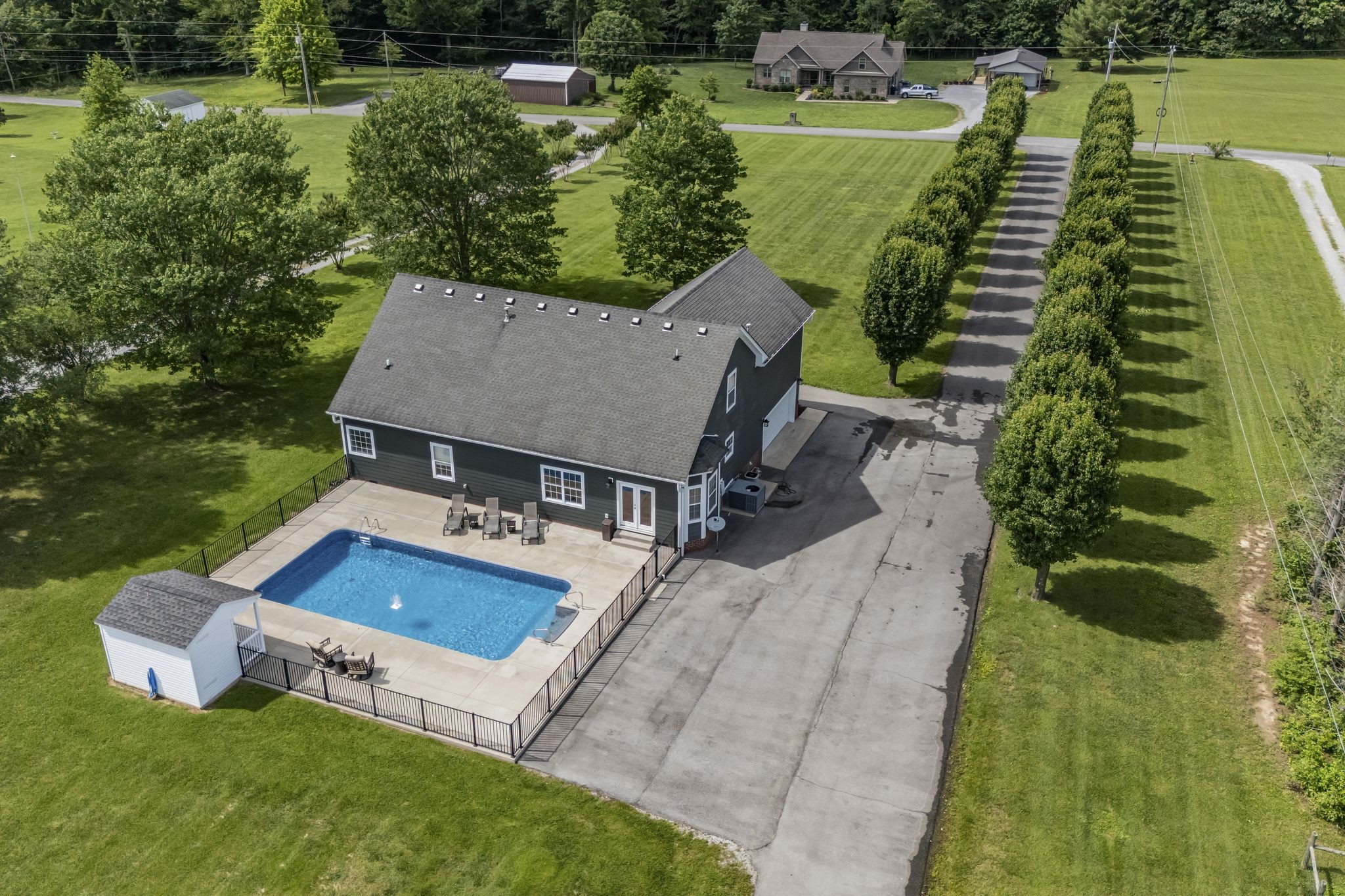 6689 East Benton Road Springfield, TN 37172 - Photo 3 of 44 an aerial view of a house with swimming pool and garden