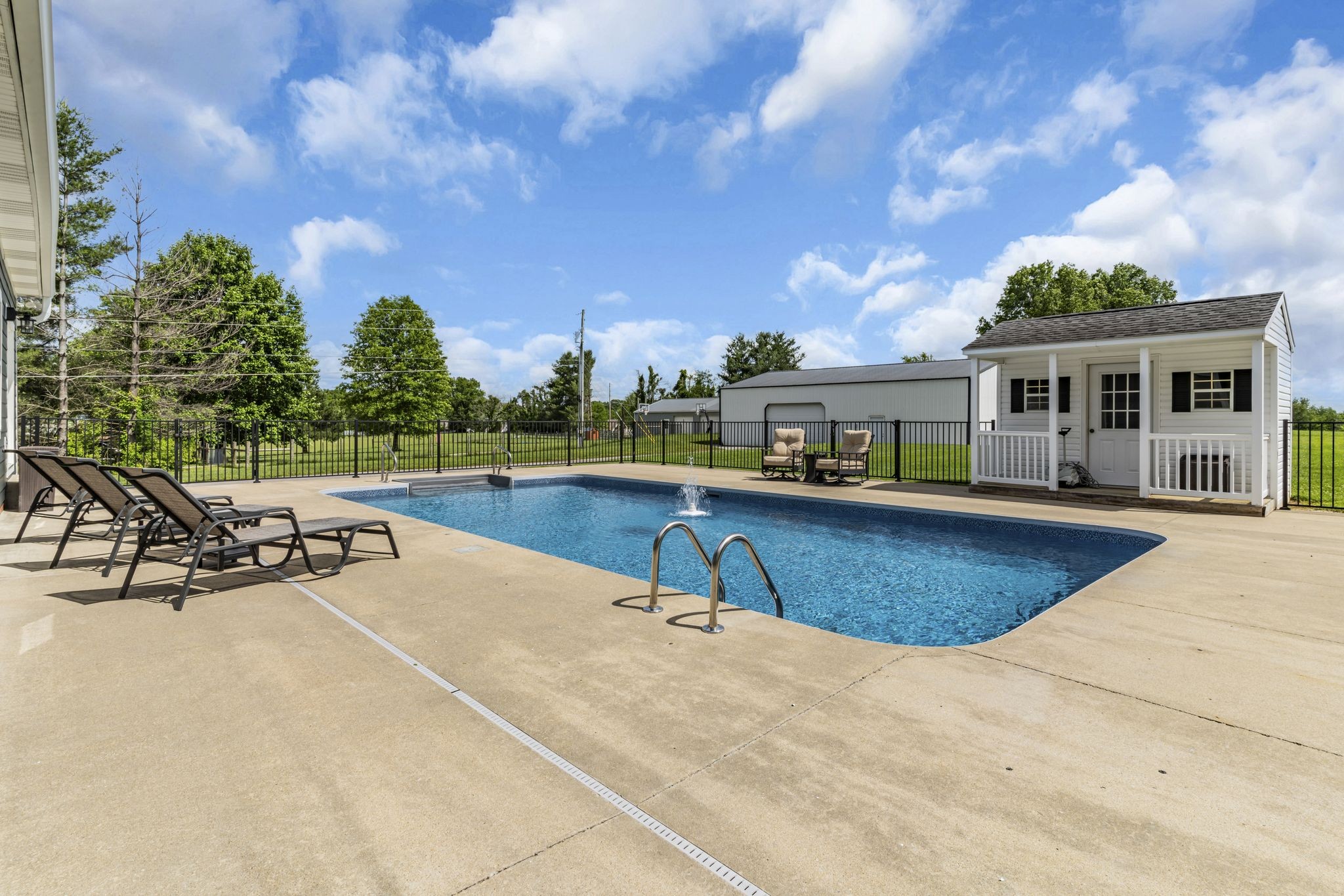 6689 East Benton Road Springfield, TN 37172 - Photo 8 of 44 a view of a house with swimming pool and sitting area