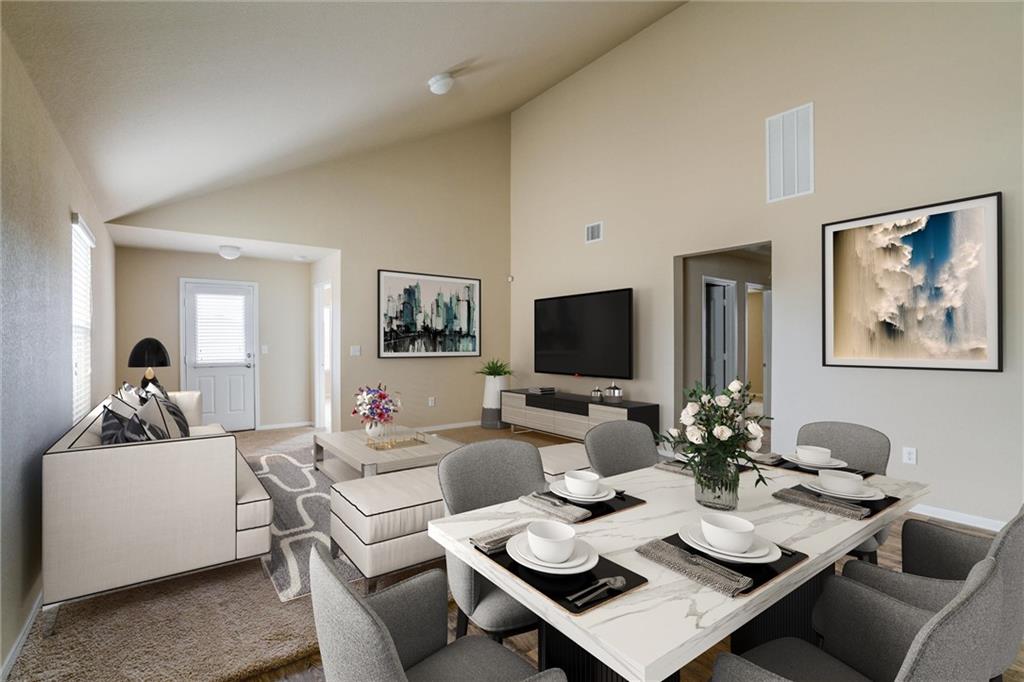 11704 Andesite Road Manor, TX 78653 - Photo 1 of 30 a living room with furniture a rug and a flat screen tv