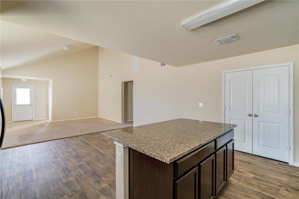 11704 Andesite Road Manor, TX 78653 - Photo 30 of 30 wooden floor in an empty room with a window