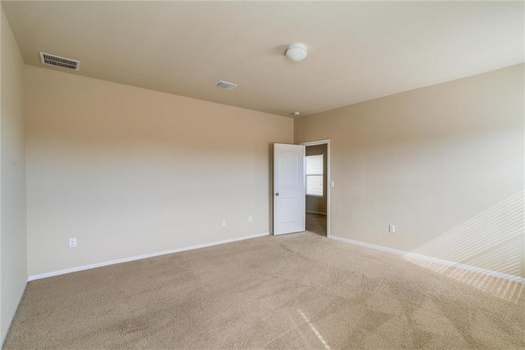 11704 Andesite Road Manor, TX 78653 - Photo 18 of 30 a view of an empty room