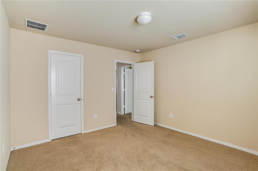 11704 Andesite Road Manor, TX 78653 - Photo 21 of 30 a view of an empty room