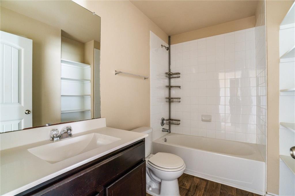 11704 Andesite Road Manor, TX 78653 - Photo 22 of 30 a bathroom with a sink a toilet and shower