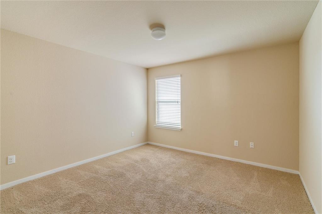 11704 Andesite Road Manor, TX 78653 - Photo 23 of 30 a view of an empty room with a window
