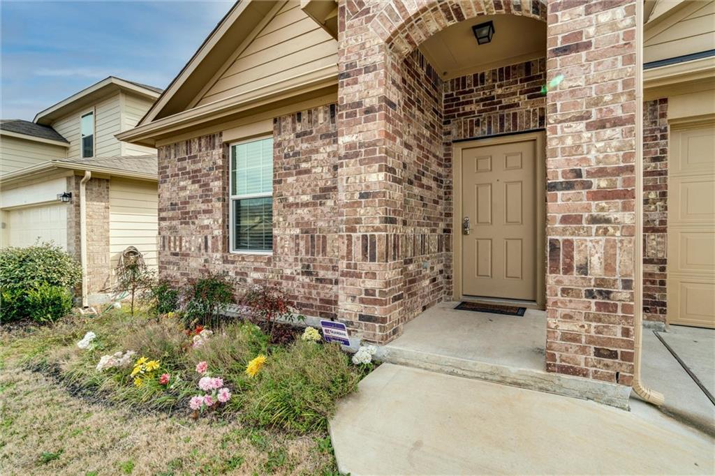 11704 Andesite Road Manor, TX 78653 - Photo 9 of 30 front view of a house with a yard