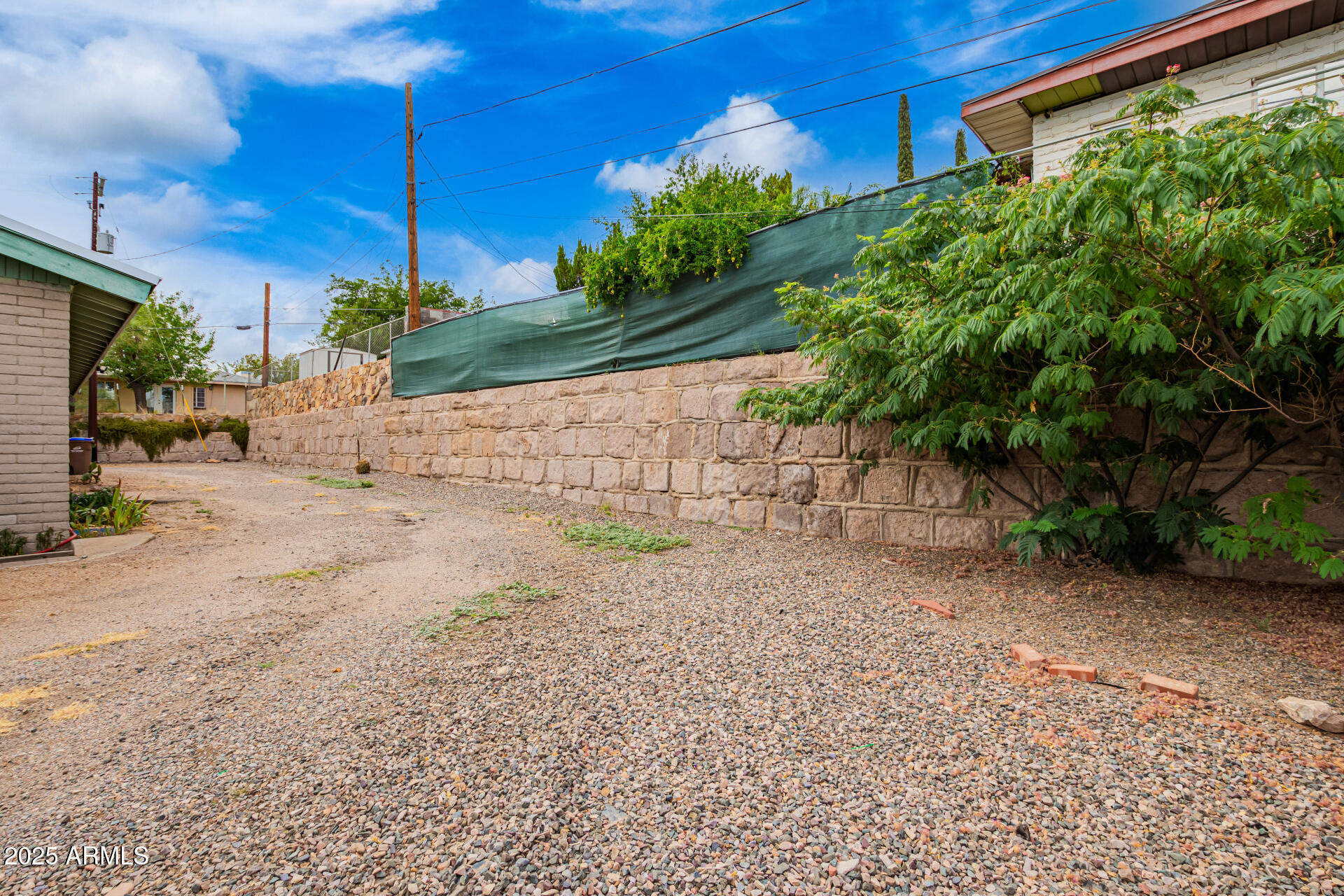 490 South 9th Street Globe, AZ 85501 - Photo 13 of 45 a view of a yard with plants and a bench