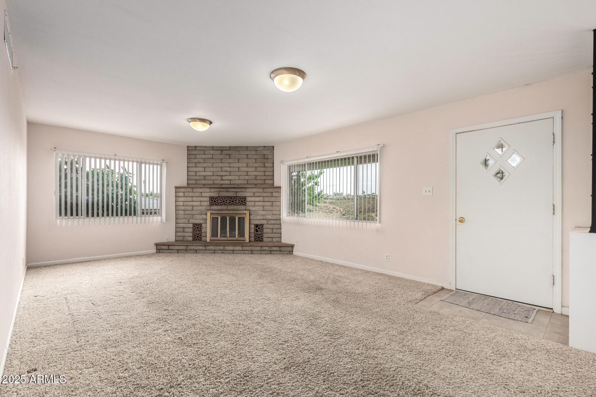 490 South 9th Street Globe, AZ 85501 - Photo 23 of 45 an empty room with windows and fireplace