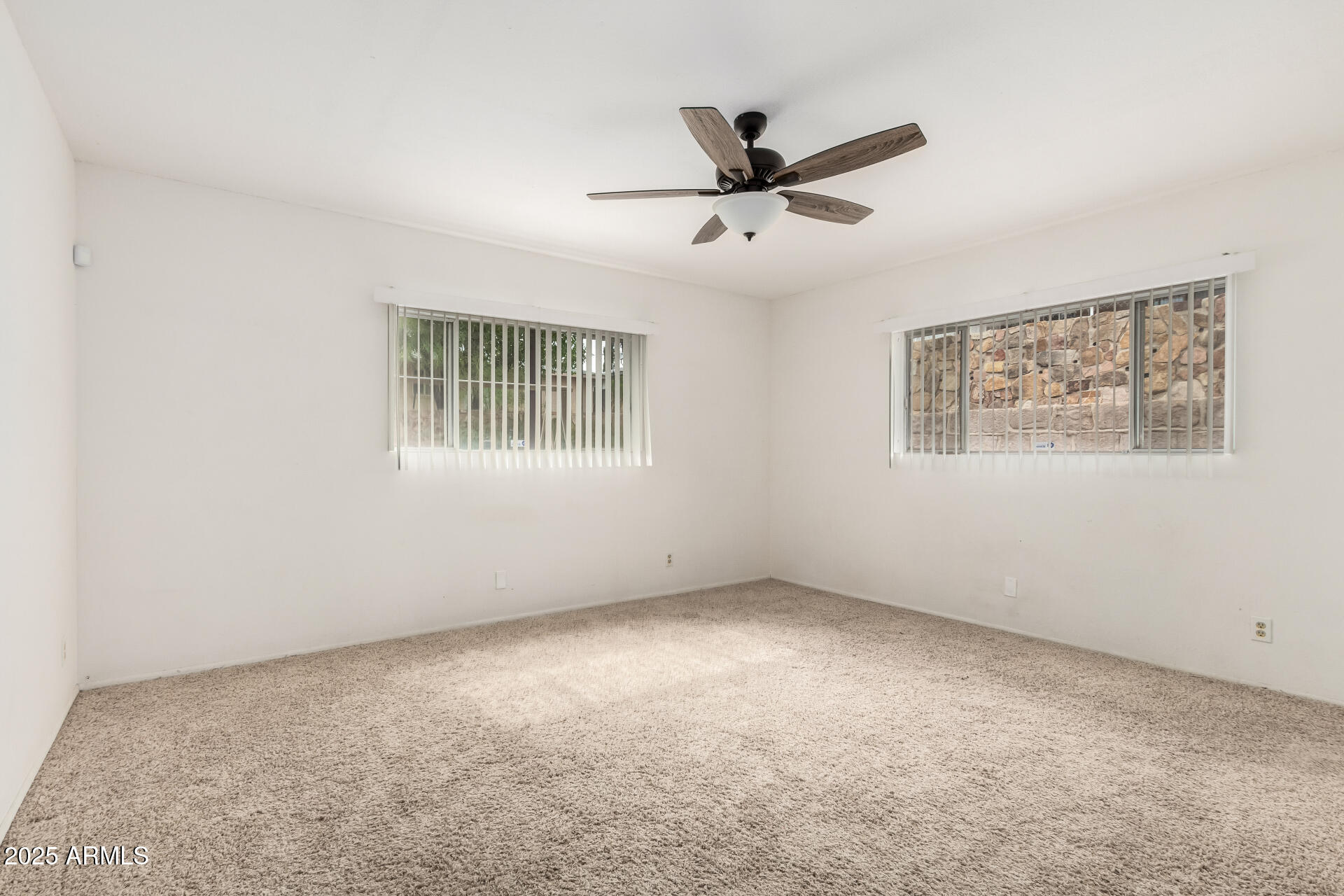 490 South 9th Street Globe, AZ 85501 - Photo 26 of 45 a view of a big room with windows and chandelier fan