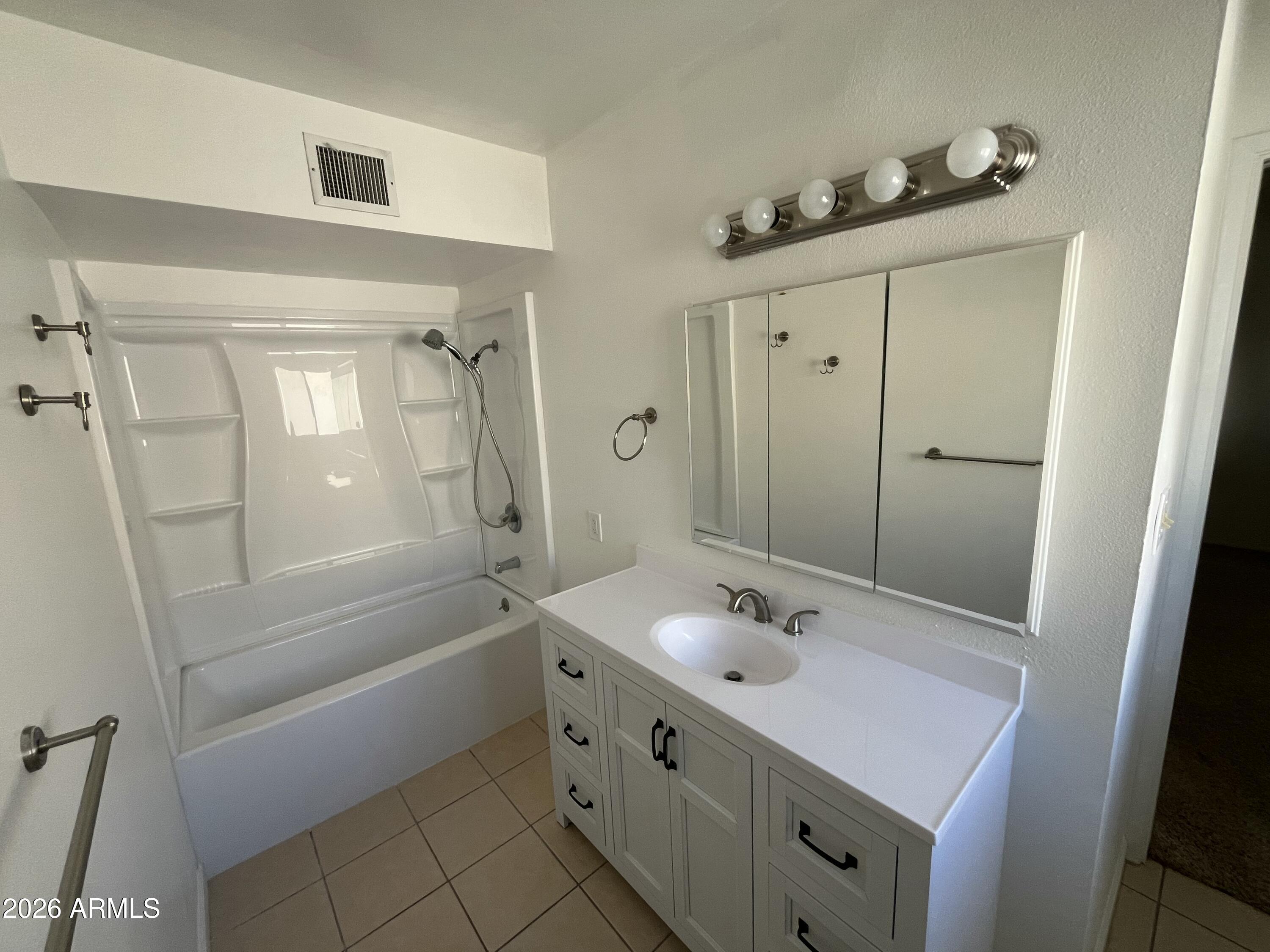 490 South 9th Street Globe, AZ 85501 - Photo 29 of 45 a bathroom with a shower a sink and a mirror