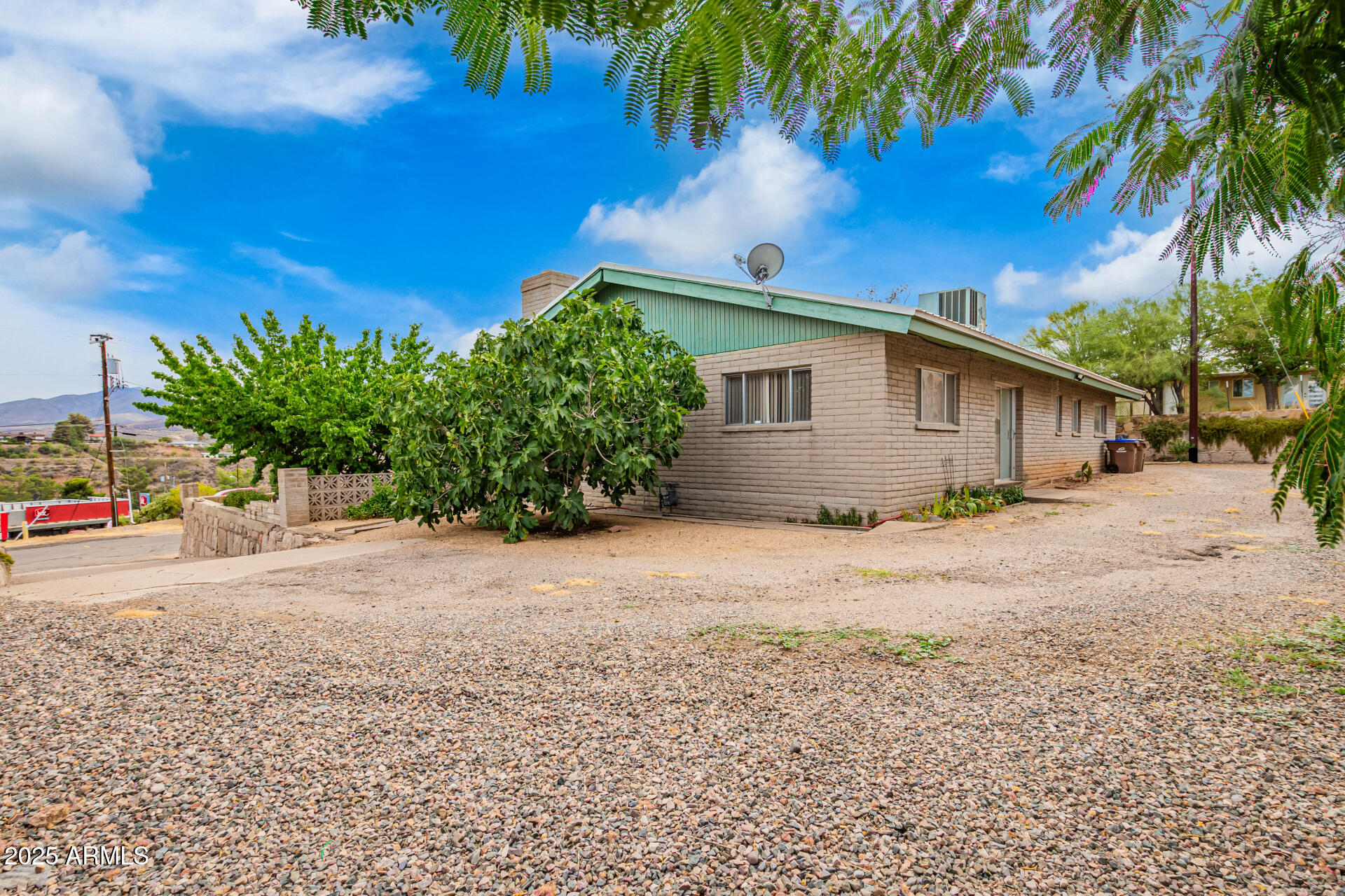 490 South 9th Street Globe, AZ 85501 - Photo 7 of 45 a front view of a house with a yard and garage