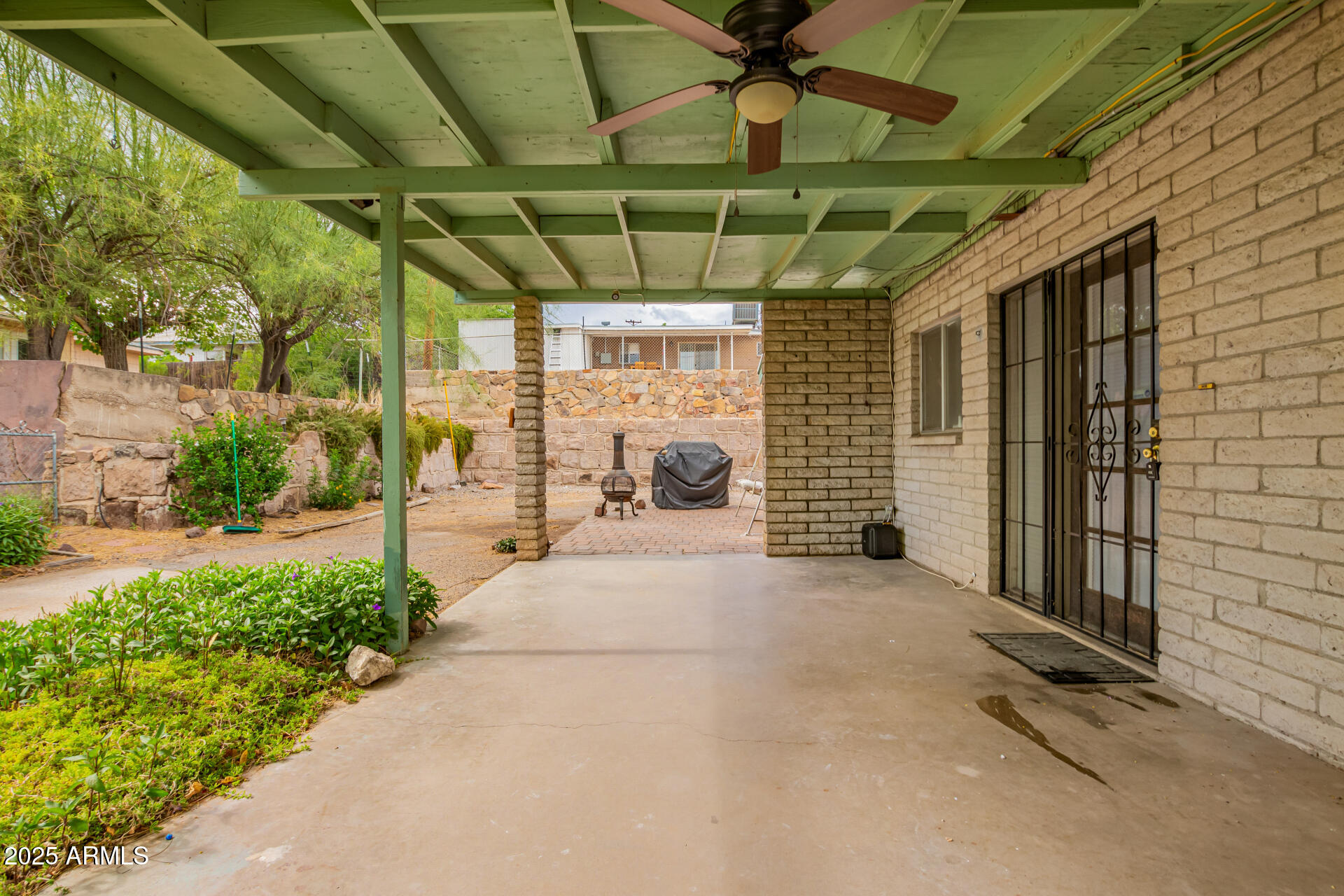 490 South 9th Street Globe, AZ 85501 - Photo 10 of 45 a view of a porch with a table and chairs under an umbrella