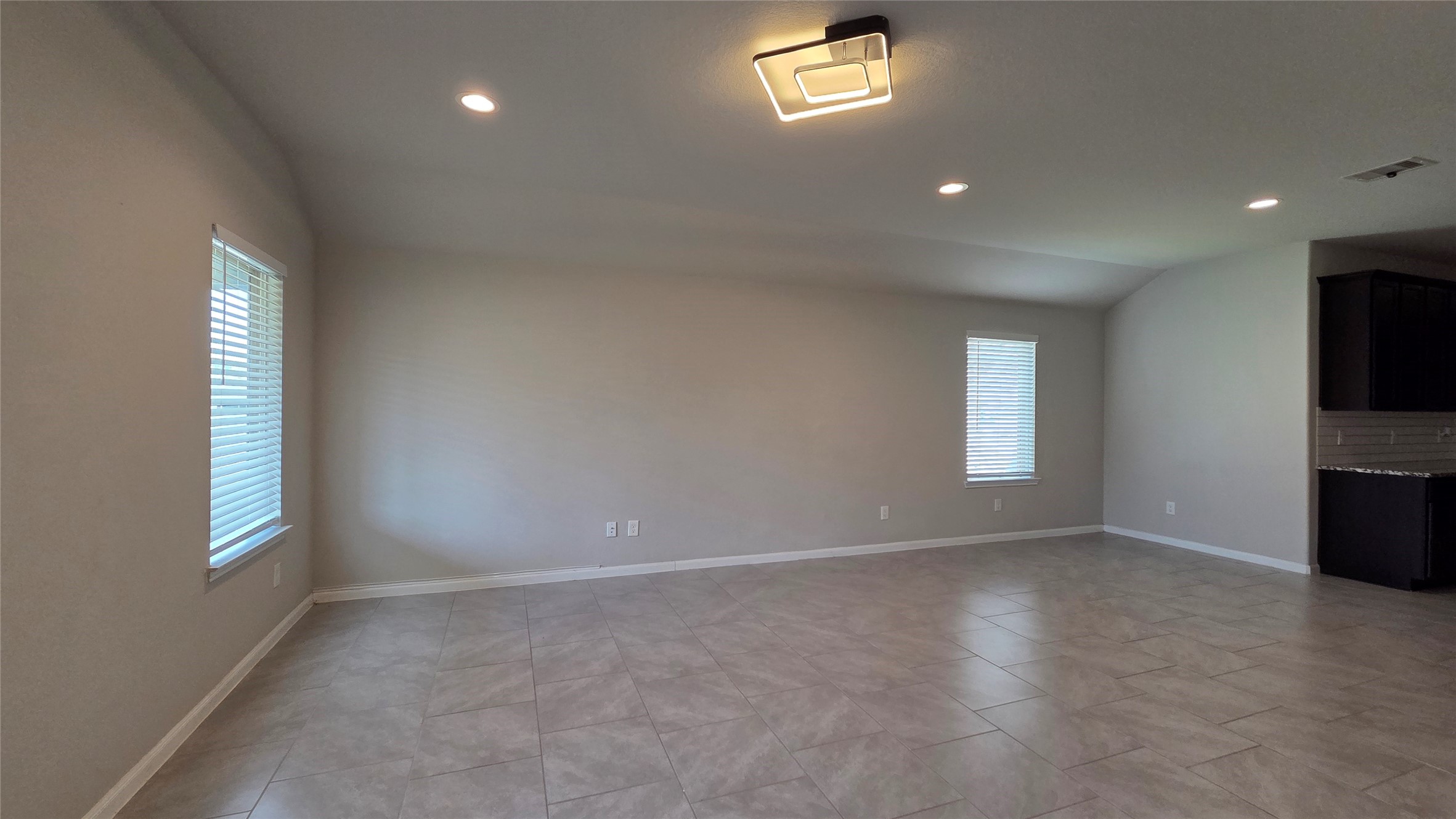 3518 Windham Way Katy, TX 77494 - Photo 8 of 18 an empty room with windows and fireplace