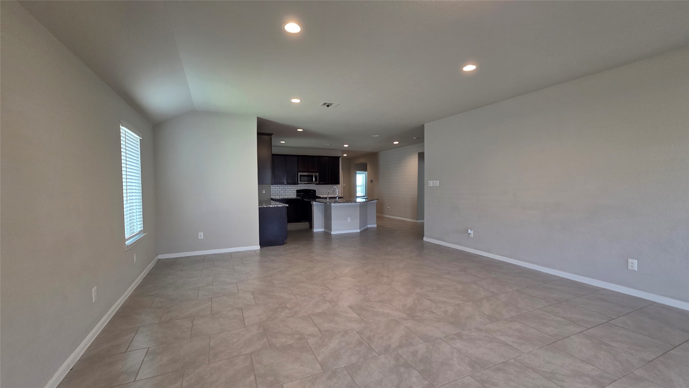 3518 Windham Way Katy, TX 77494 - Photo 9 of 18 a view of a kitchen with a sink and a window