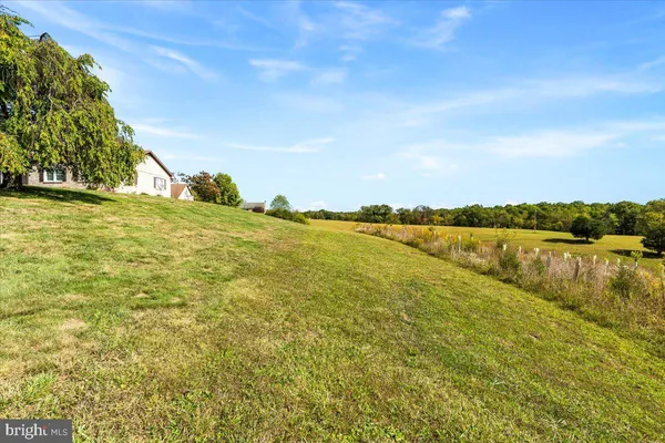 a view of a lake with houses in the back