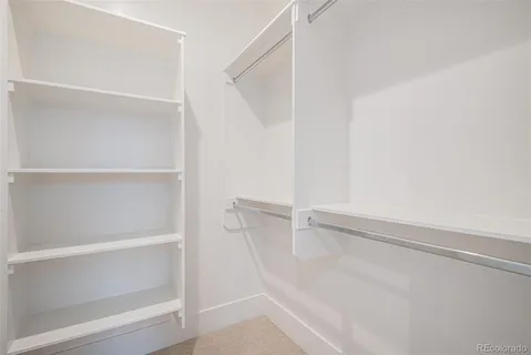 a view of an empty walk in closet