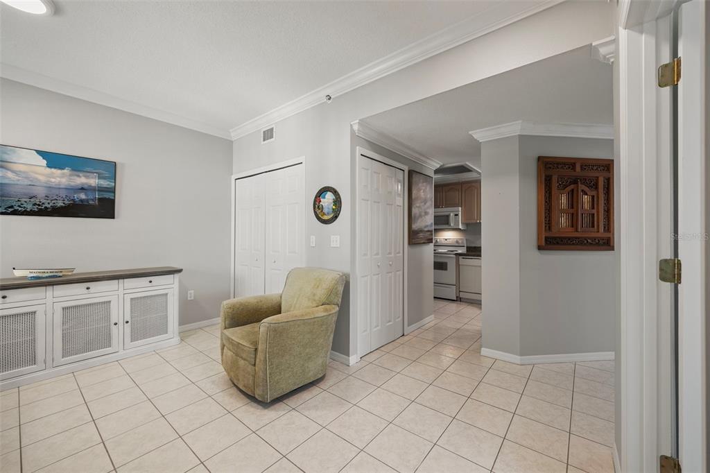 399 150th Avenue, Unit 309 Madeira Beach, FL 33708 - Photo 18 of 43 a living room with furniture and painting on the wall