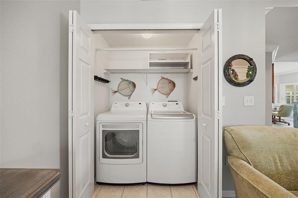 399 150th Avenue, Unit 309 Madeira Beach, FL 33708 - Photo 20 of 43 a utility room with dryer and washer