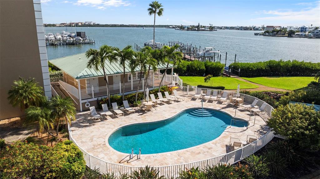 399 150th Avenue, Unit 309 Madeira Beach, FL 33708 - Photo 3 of 43 an aerial view of a house with outdoor space and lake view