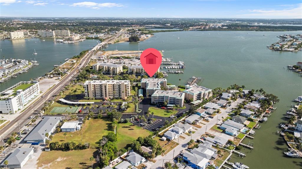 399 150th Avenue, Unit 309 Madeira Beach, FL 33708 - Photo 38 of 43 an aerial view of a house with a ocean view
