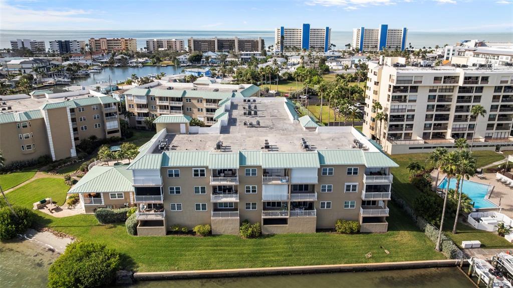 399 150th Avenue, Unit 309 Madeira Beach, FL 33708 - Photo 40 of 43 a large building with a view of a city