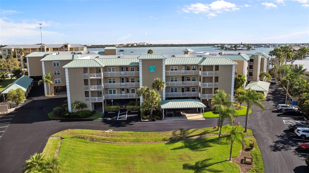 399 150th Avenue, Unit 309 Madeira Beach, FL 33708 - Photo 43 of 43 a view of a swimming pool with a patio