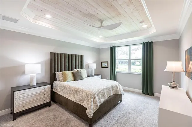 a bedroom with a bed and a night stand