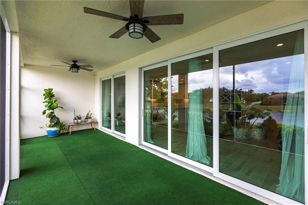 2319 Sawyers Hill Road, Unit 703 Naples, FL 34120 - Photo 29 of 35 a view of a porch and garden