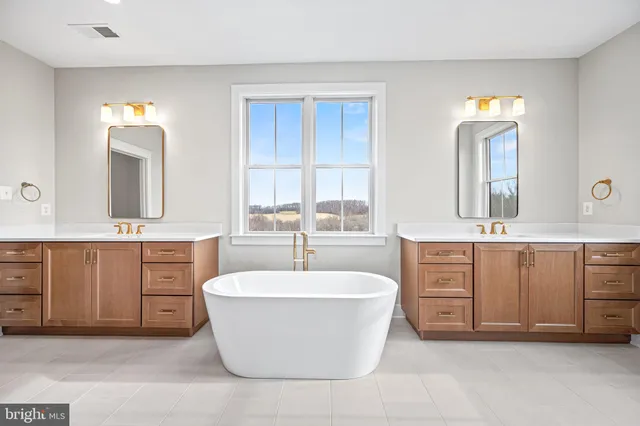 a bathroom with a glass door shower a sink and a mirror
