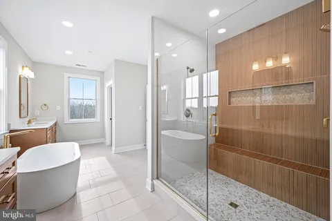 a bathroom with a bathtub and shower