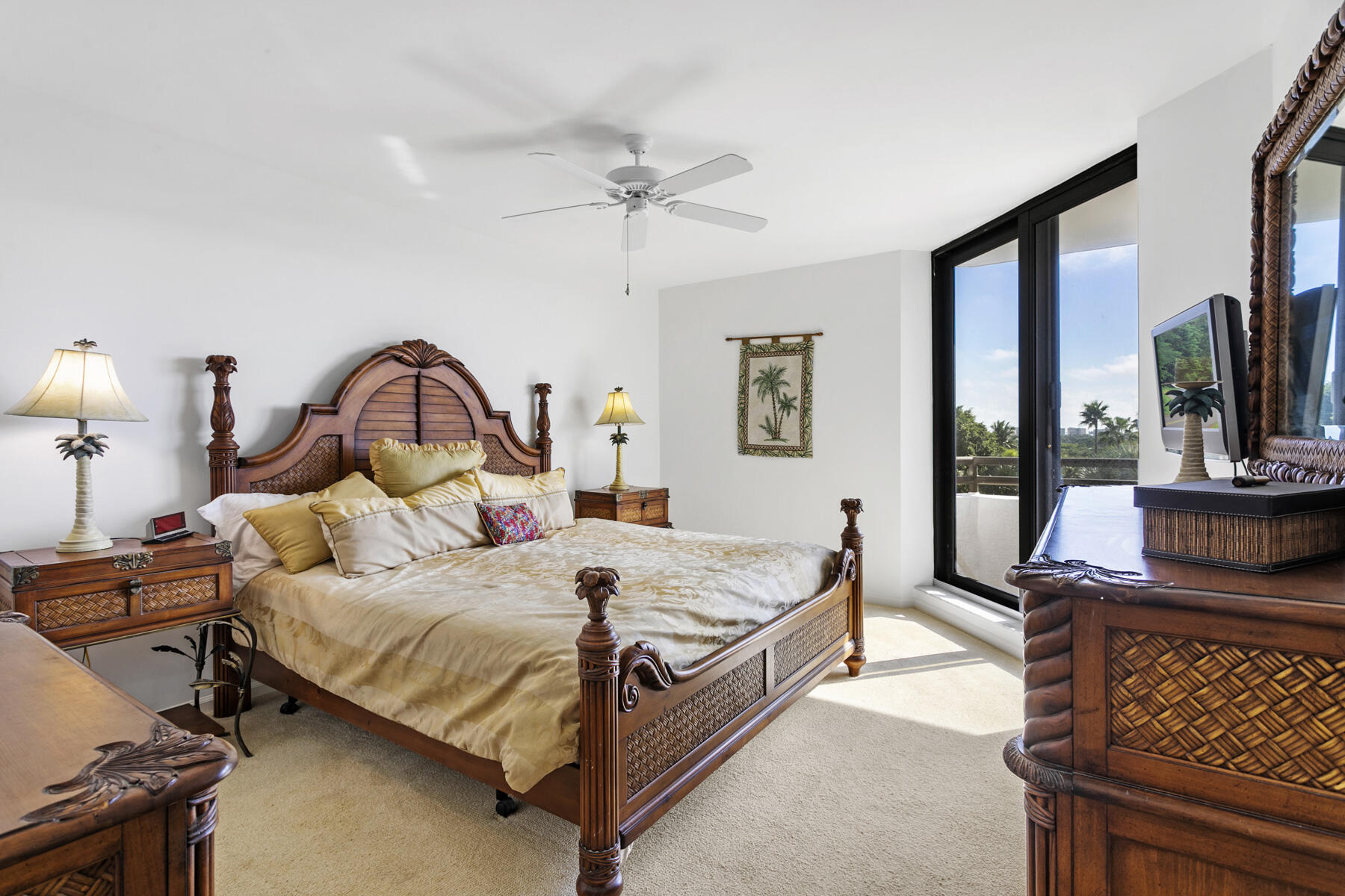 3322 Casseekey Island Road, Unit 504 Jupiter, FL 33477 - Photo 16 of 46 a bedroom with a bed and large windows