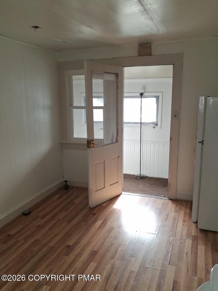 520 Hickory Street, Unit 3 Scranton, PA 18505 - Photo 2 of 10 an empty room with wooden floor and a window