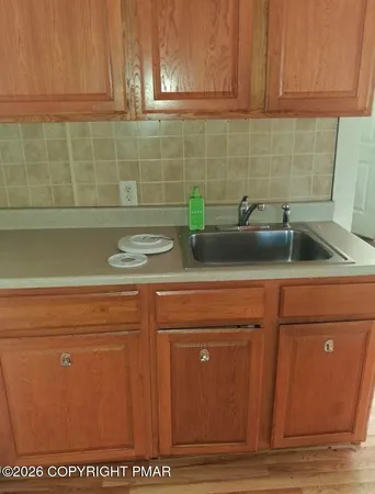 a close view of sink and cabinets