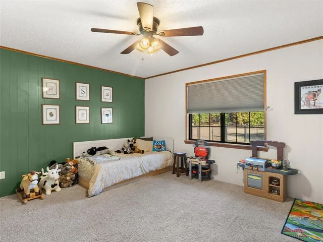 a living room with furniture toys and a window