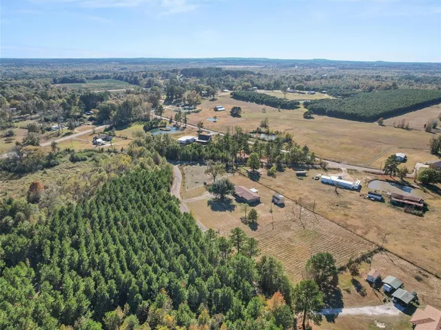 an aerial view of a city with ocean view