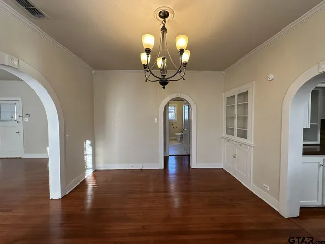 a view of an entryway with wooden floor