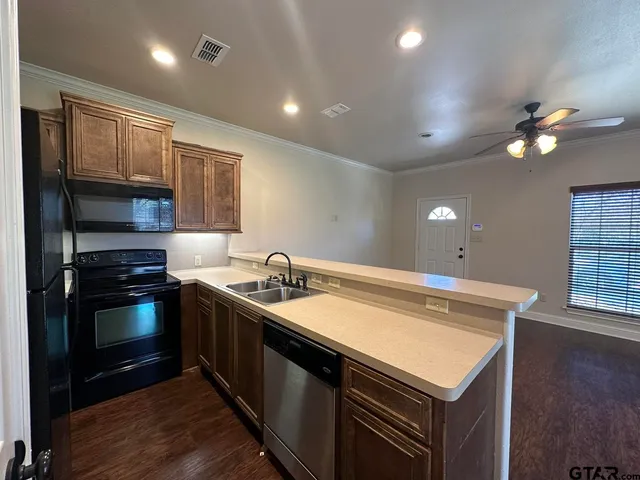 a kitchen with a refrigerator stove and sink