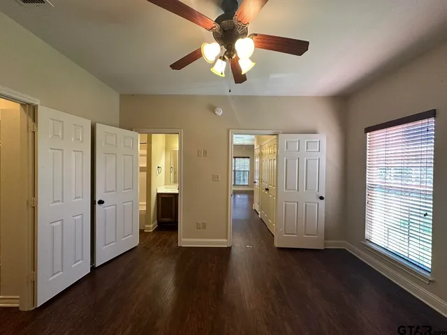 a bathroom with a sink vanity and a mirror