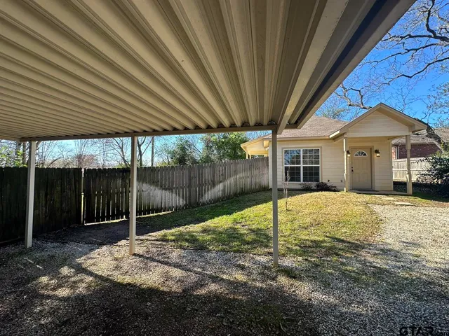 a backyard of a house with lots of green space