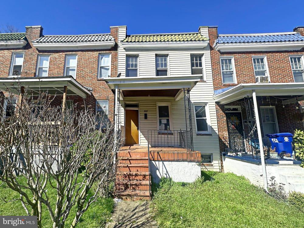 930 North Rosedale Street Baltimore, MD 21216 - Photo 1 of 9 a front view of a house with garden