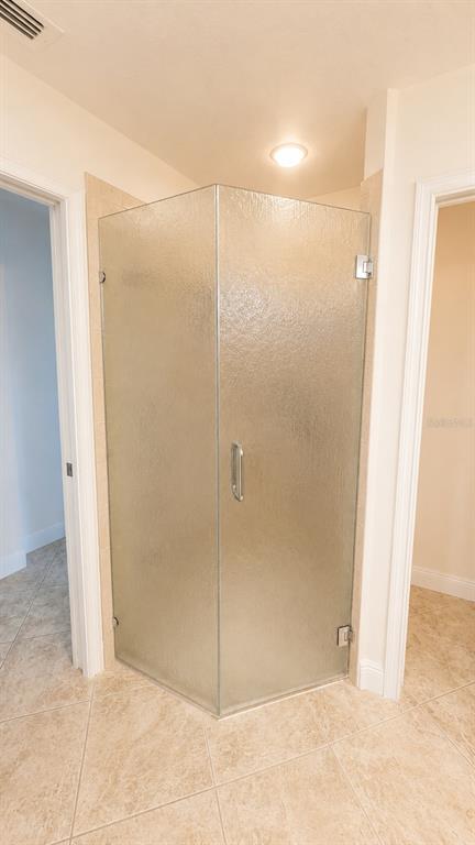 6552 Moorings Point Circle, Unit 102 Lakewood Ranch, FL 34202 - Photo 20 of 57 a bathroom with a shower