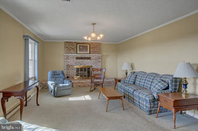 a view of an empty room and fire place